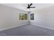 Bright bedroom featuring a ceiling fan, a window, and neutral color palette at 1012 E Rosebud Dr, San Tan Valley, AZ 85143