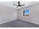 Bright bedroom featuring a ceiling fan, a window, and neutral color palette at 1012 E Rosebud Dr, San Tan Valley, AZ 85143