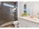 Modern bathroom with tiled shower, sink with white vanity, and contemporary fixtures at 10147 W Camino De Oro --, Peoria, AZ 85383