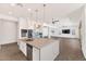 Modern kitchen with an island, stainless steel appliances, and pendant lighting at 10147 W Camino De Oro --, Peoria, AZ 85383