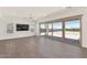 Bright living room featuring tile floors, recessed lighting, and expansive sliding glass doors leading to the patio at 10147 W Camino De Oro --, Peoria, AZ 85383