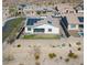 Home showcasing desert landscaping, solar panels, and back yard at 10249 W Redbird Rd, Peoria, AZ 85383