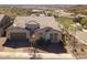 Charming single-story home features desert landscaping, a tile roof, and a two-car garage at 10249 W Redbird Rd, Peoria, AZ 85383