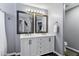 Elegant bathroom with double vanity, framed mirrors, and stylish fixtures at 10256 N 12Th Pl # 3, Phoenix, AZ 85020