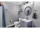 Well-lit bathroom features a modern vanity, toilet, and stylish fixtures at 10256 N 12Th Pl # 3, Phoenix, AZ 85020