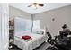 Cozy bedroom featuring a bed, workspace, window, and simple decor, creating a functional and comfortable space at 10256 N 12Th Pl # 3, Phoenix, AZ 85020