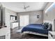 Bright bedroom featuring a modern dresser, a ceiling fan, and a sliding glass door at 10256 N 12Th Pl # 3, Phoenix, AZ 85020