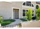 Cozy front entrance with stone walkway, lush greenery, and covered porch area at 10256 N 12Th Pl # 3, Phoenix, AZ 85020