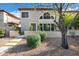 Charming two-story home with well-maintained landscaping, decorative wall, and mature shade trees at 10256 N 12Th Pl # 3, Phoenix, AZ 85020