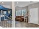 Bright living room featuring hardwood floors, a modern fireplace, and large windows with natural light at 10256 N 12Th Pl # 3, Phoenix, AZ 85020