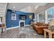 Stylish living room with a statement wall, leather sofa, and large windows at 10256 N 12Th Pl # 3, Phoenix, AZ 85020