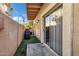 Enclosed patio area featuring artificial turf and sliding glass door entrance at 10256 N 12Th Pl # 3, Phoenix, AZ 85020