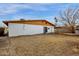 Spacious backyard featuring a white brick wall and a patch of dry grass at 104 S Doran --, Mesa, AZ 85204