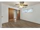 Bedroom featuring vinyl floors, neutral walls, and built-in storage at 104 S Doran --, Mesa, AZ 85204