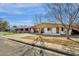 Charming single-story home with a carport and low-maintenance front yard at 104 S Doran --, Mesa, AZ 85204