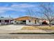 Cozy single-story home featuring a covered carport and desert landscaping at 104 S Doran --, Mesa, AZ 85204