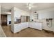 Outdated kitchen featuring white cabinets, laminate countertops, and ceiling fan at 104 S Doran --, Mesa, AZ 85204