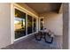 Covered back patio with paver flooring and a picnic table, great for outdoor entertaining at 10532 E Palladium Dr, Mesa, AZ 85212