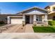 Charming single-story home with a welcoming front porch and well-maintained landscaping at 10532 E Palladium Dr, Mesa, AZ 85212