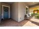 Cozy front porch with seating, creating an inviting entrance to the home at 10532 E Palladium Dr, Mesa, AZ 85212