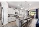 Modern kitchen featuring white cabinets, stainless steel appliances, and a granite island at 10532 E Palladium Dr, Mesa, AZ 85212