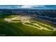 Aerial view of a community skate park featuring ramps, rails, and landscaping at 10532 E Palladium Dr, Mesa, AZ 85212