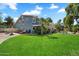 Lush green backyard with well-maintained lawn, mature trees, and inviting outdoor lounge and recreation areas at 10800 N 101St St, Scottsdale, AZ 85260