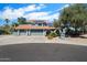 Inviting two-story home featuring a terracotta roof, solar panels, and a well-manicured front yard at 10800 N 101St St, Scottsdale, AZ 85260