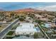 Stunning aerial view of a modern home with pool, set against a picturesque mountain backdrop and neighborhood at 109 E Hayward Ave, Phoenix, AZ 85020