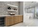 Spacious bathroom featuring wooden cabinets with a modern standalone tub and glass shower at 109 E Hayward Ave, Phoenix, AZ 85020