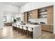 Well lit kitchen showcasing a spacious island with barstool seating, modern appliances and cabinetry at 109 E Hayward Ave, Phoenix, AZ 85020