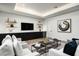 Cozy living room featuring a modern media center, comfortable seating, and ample natural light at 109 E Hayward Ave, Phoenix, AZ 85020