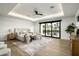 Bright main bedroom featuring a seating area, natural lighting, and an elegant tray ceiling at 109 E Hayward Ave, Phoenix, AZ 85020