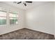 Carpeted bedroom boasts bright natural light and neutral walls at 11918 W Yearling Ct, Peoria, AZ 85383