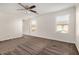 Bedroom with neutral carpet and trim, with two large windows bringing in natural light at 11918 W Yearling Ct, Peoria, AZ 85383