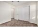 Bedroom featuring carpet, neutral walls and a large closet at 11918 W Yearling Ct, Peoria, AZ 85383