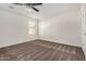 Bedroom with neutral carpet and trim, with large window bringing in natural light at 11918 W Yearling Ct, Peoria, AZ 85383