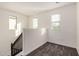 Loft with neutral carpet and natural light coming in from two large windows at 11918 W Yearling Ct, Peoria, AZ 85383