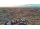 Expansive aerial view of a desert community showcasing beautiful mountain views and a serene landscape at 12008 S 186Th Dr, Goodyear, AZ 85338