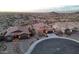 An aerial view showing the front exteriors of several homes in the community nestled in a desert at 12008 S 186Th Dr, Goodyear, AZ 85338