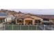 Fenced backyard featuring lush grass, seating, mountain views, and privacy at 12008 S 186Th Dr, Goodyear, AZ 85338