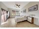 Serene bedroom with tile floors, neutral walls, and a ceiling fan for comfort at 12008 S 186Th Dr, Goodyear, AZ 85338