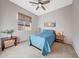 Bedroom with carpet flooring, bamboo shades, and a modern ceiling fan at 12008 S 186Th Dr, Goodyear, AZ 85338