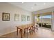 Elegant dining room area with scenic views, plenty of natural light, and stylish furnishings at 12008 S 186Th Dr, Goodyear, AZ 85338