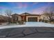 Charming single-story home with a well-manicured desert landscape and a two-car garage at 12008 S 186Th Dr, Goodyear, AZ 85338