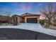 Charming single-story home with a well-manicured desert landscape and a two-car garage at 12008 S 186Th Dr, Goodyear, AZ 85338