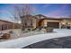 Charming single-story home with a well-manicured desert landscape and a two-car garage at 12008 S 186Th Dr, Goodyear, AZ 85338