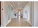 Inviting foyer with tiled floors and neutral walls, leading to various rooms in this well-maintained home at 12008 S 186Th Dr, Goodyear, AZ 85338