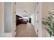 Inviting home office features built-in shelving, neutral carpet, and double doors for privacy, creating an ideal workspace at 12008 S 186Th Dr, Goodyear, AZ 85338