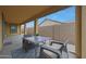 Covered patio with outdoor seating, perfect for relaxation and entertaining at 1257 N 166Th Ave, Goodyear, AZ 85338